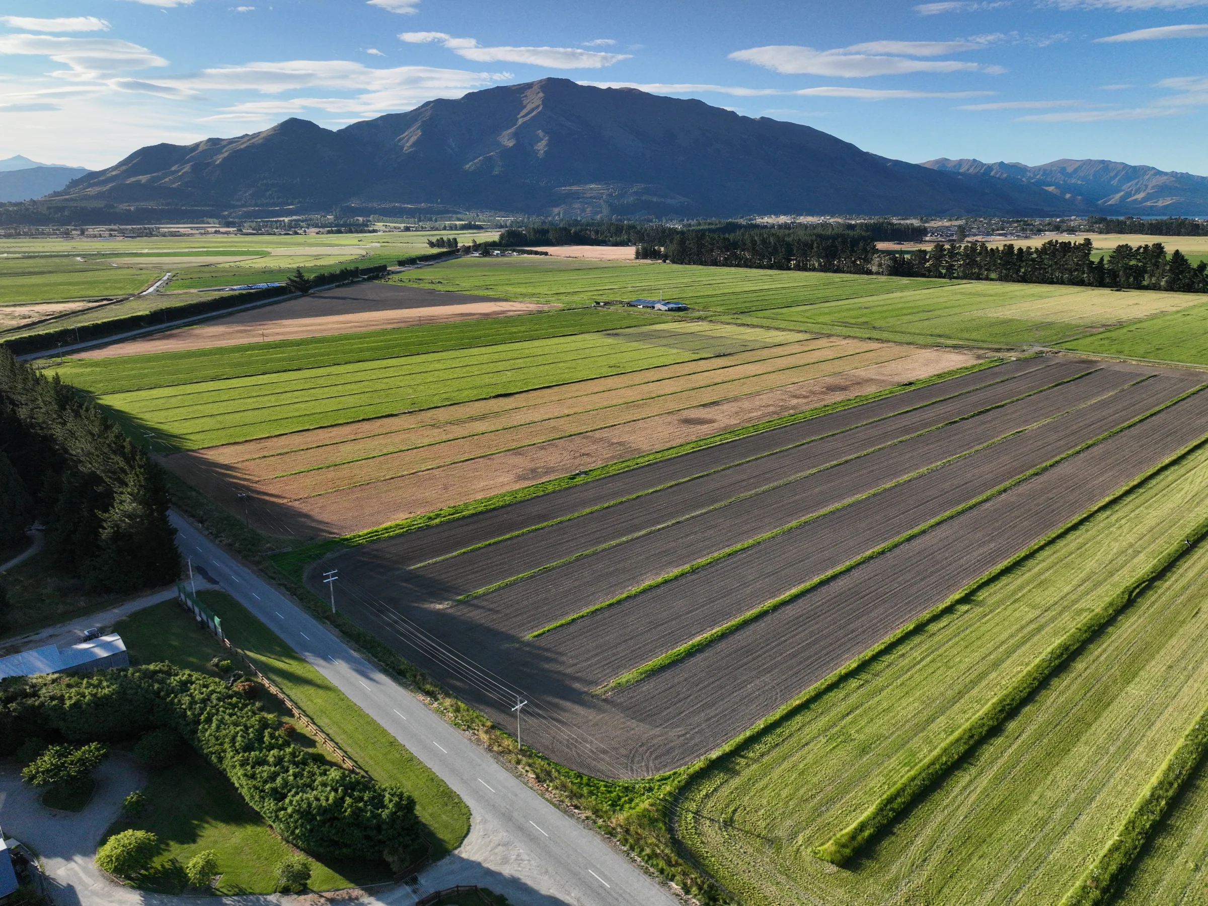 Aerial view of New Zealand farmland, roads and mapped fields